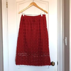 Anthropologie orange-red lace / eyelet pencil skirt.  3/4 length.